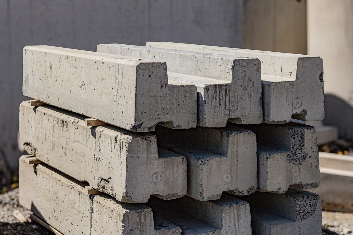 Precast concrete curb components stacked in the product yard