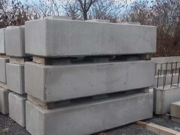 Full-size precast concrete blocks stacked in the product yard