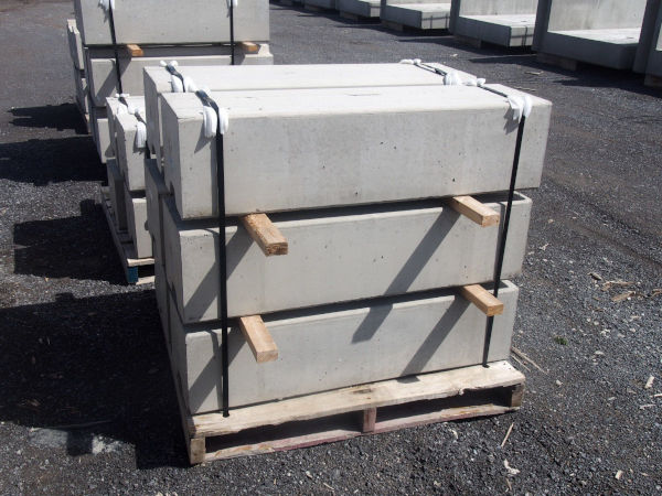 Precast platform curb top components stacked on a pallet