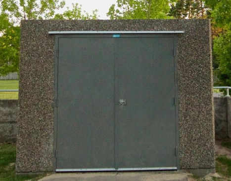 Double-door precast concrete service building exterior