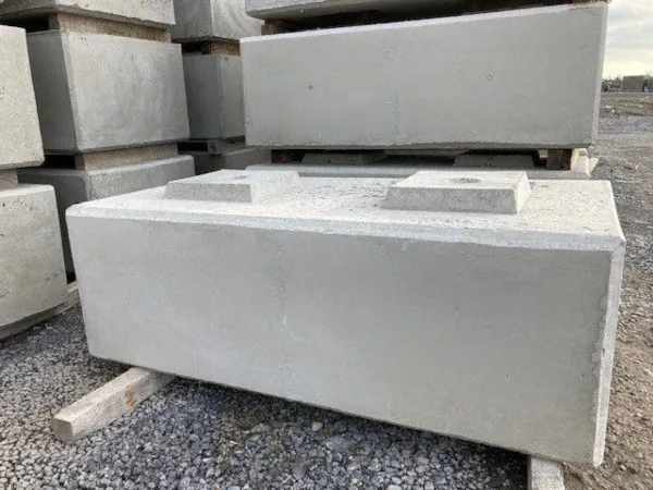 Precast concrete block with interlocking features stored in the yard